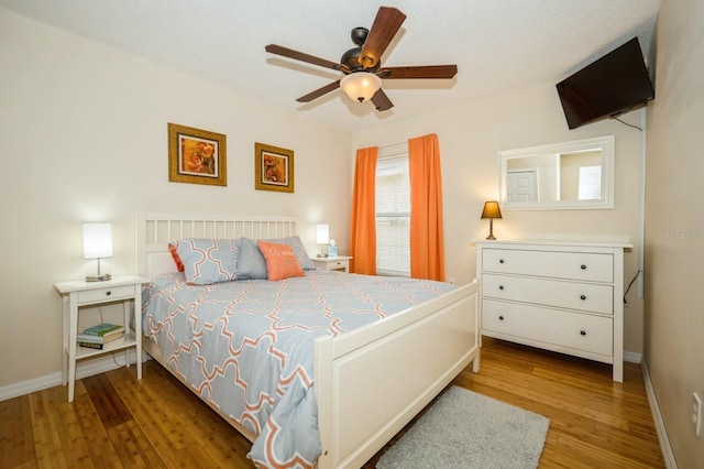 bedroom featuring ceiling fan and light hardwood / wood-style flooring