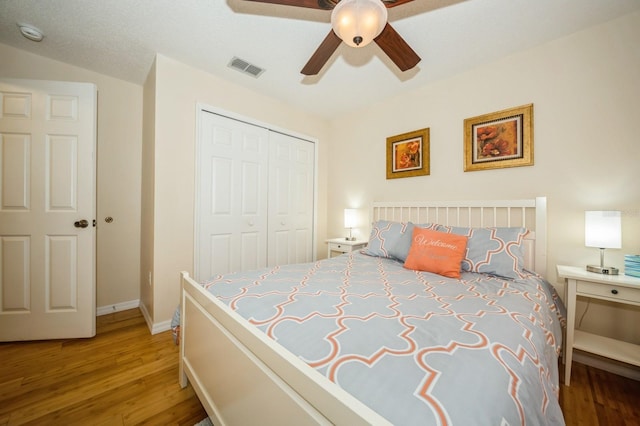 bedroom featuring a closet, ceiling fan, and hardwood / wood-style flooring