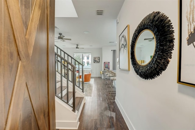 corridor featuring dark wood-type flooring