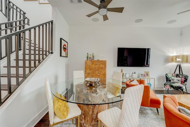 dining room featuring dark hardwood / wood-style flooring and ceiling fan