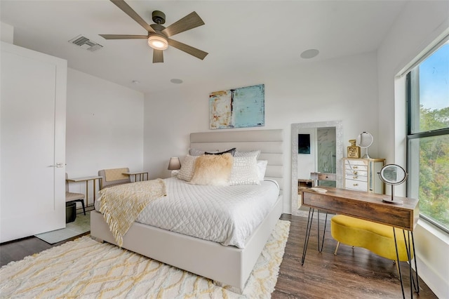 bedroom with hardwood / wood-style floors and ceiling fan