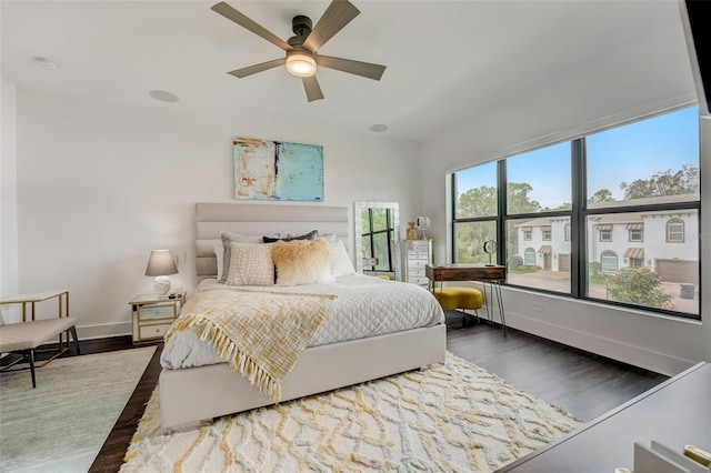 bedroom featuring dark hardwood / wood-style floors and ceiling fan