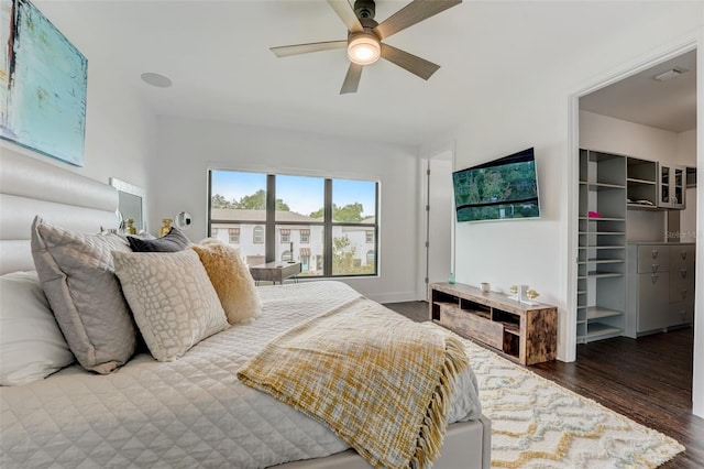 bedroom featuring dark hardwood / wood-style flooring and ceiling fan