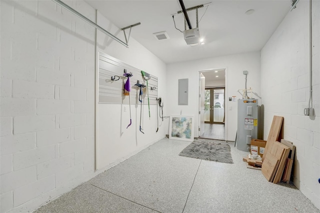 garage featuring a garage door opener and water heater