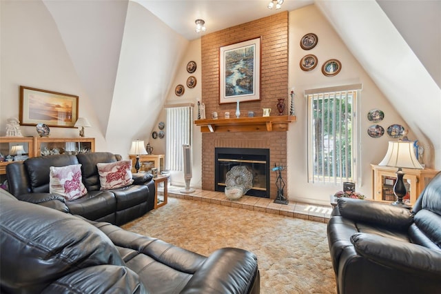 living room featuring high vaulted ceiling, brick wall, and a fireplace