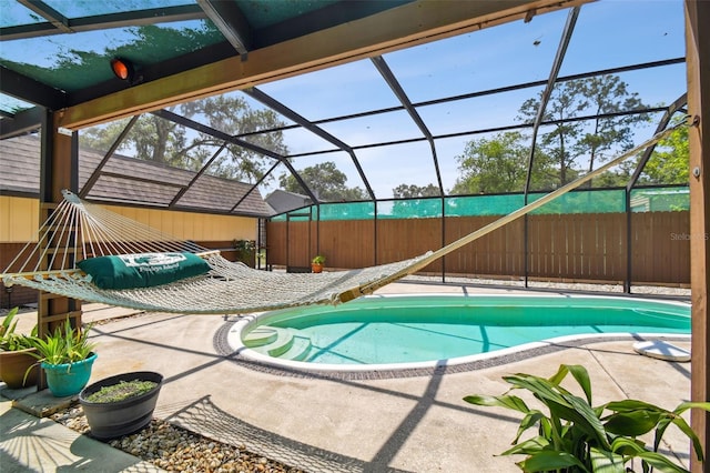 view of pool featuring a patio area and a lanai