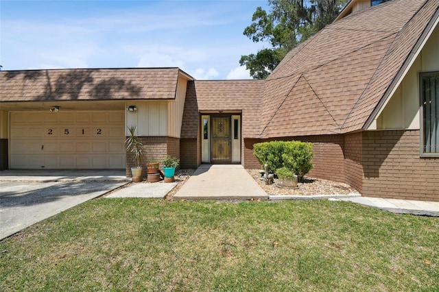 view of front of property with a garage and a front lawn