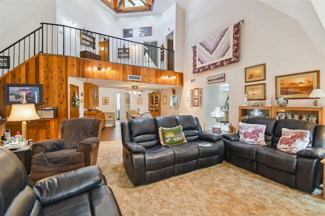 living room featuring high vaulted ceiling, ceiling fan, and hardwood / wood-style flooring