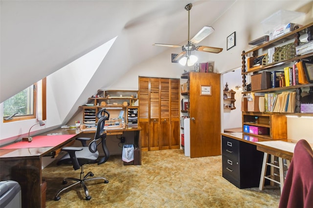 carpeted home office featuring ceiling fan and vaulted ceiling