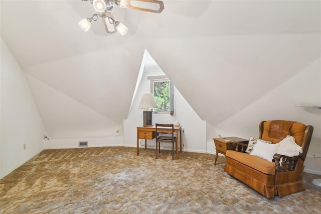 sitting room with vaulted ceiling, carpet floors, and ceiling fan