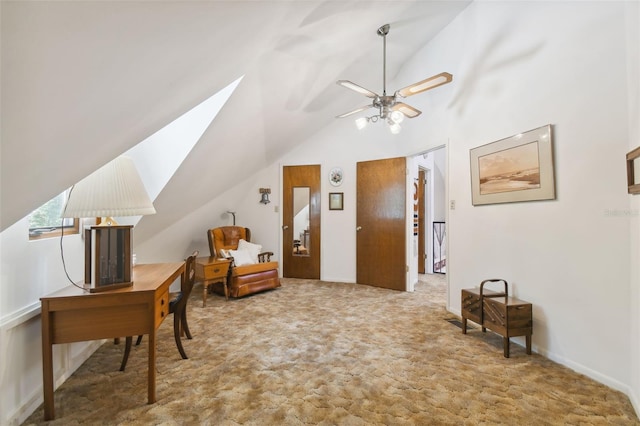 office area with ceiling fan, carpet floors, and lofted ceiling