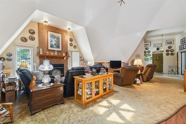 living room with brick wall, a brick fireplace, carpet floors, and lofted ceiling