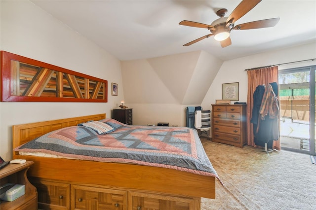 carpeted bedroom with vaulted ceiling, ceiling fan, and access to outside