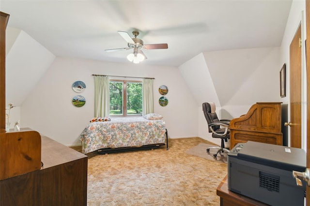 bedroom with ceiling fan, carpet floors, and lofted ceiling