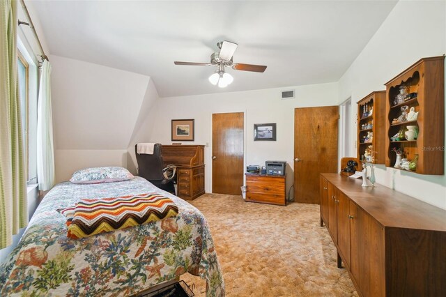 bedroom featuring light colored carpet and ceiling fan