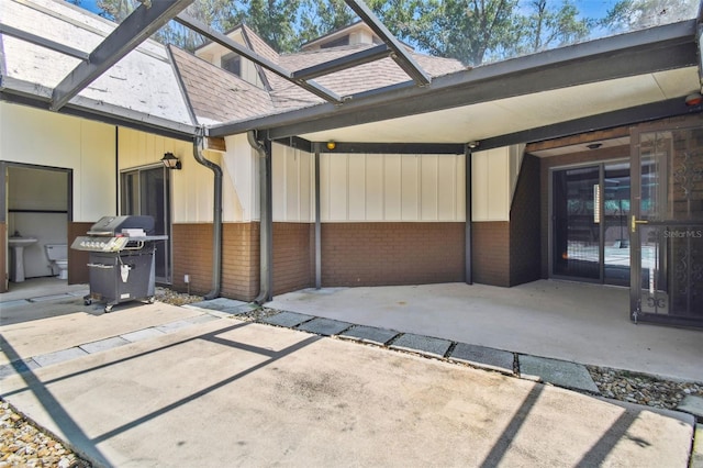 view of patio featuring a grill and sink