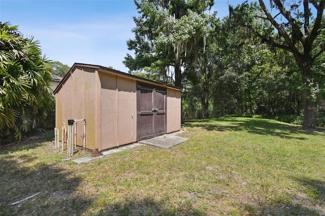 view of shed / structure with a yard