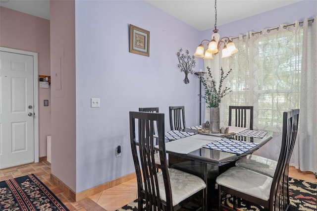 dining space featuring a chandelier