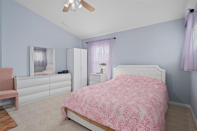 bedroom with light carpet, high vaulted ceiling, ceiling fan, and multiple windows