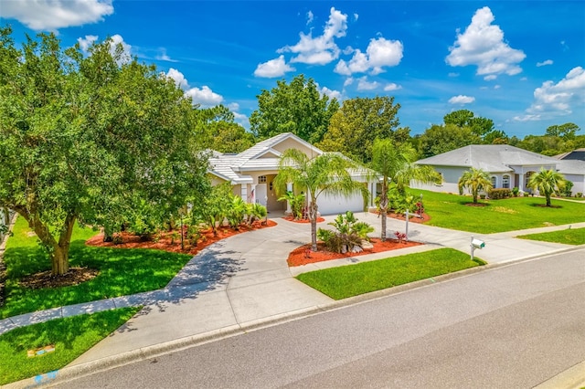 view of front of house with a front lawn and a garage