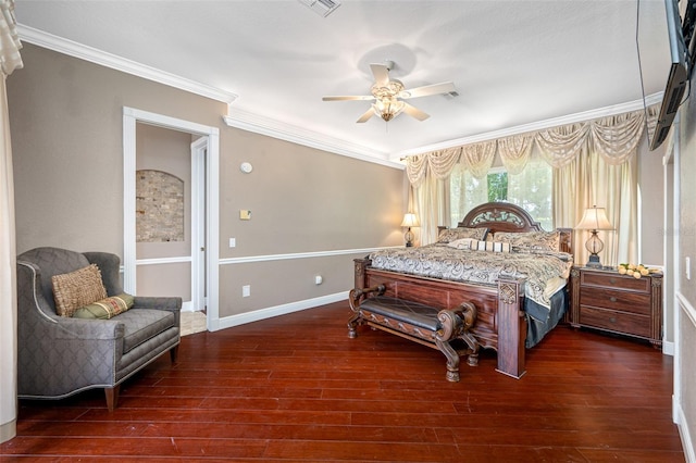 bedroom with ornamental molding, dark hardwood / wood-style floors, and ceiling fan