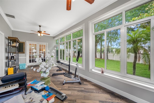 sunroom featuring ceiling fan, french doors, and a wealth of natural light