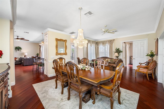 dining area featuring ornamental molding, dark hardwood / wood-style floors, and ceiling fan with notable chandelier