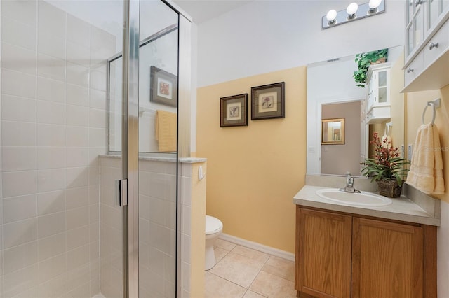 bathroom with oversized vanity, toilet, walk in shower, and tile flooring