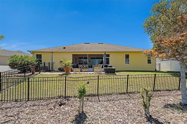 rear view of house featuring outdoor lounge area, a lawn, and a patio