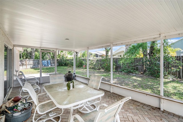 unfurnished sunroom with a healthy amount of sunlight