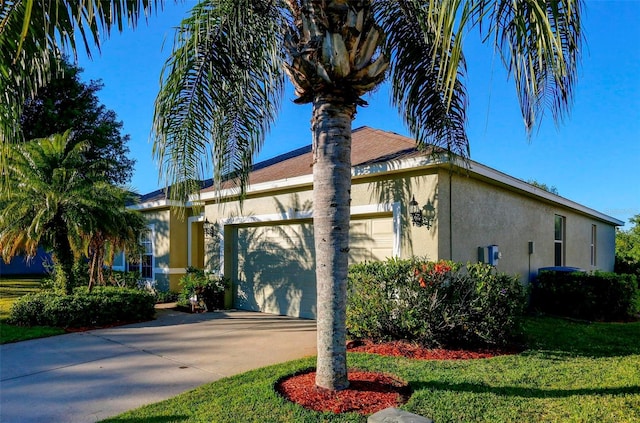 view of property exterior with a lawn and a garage