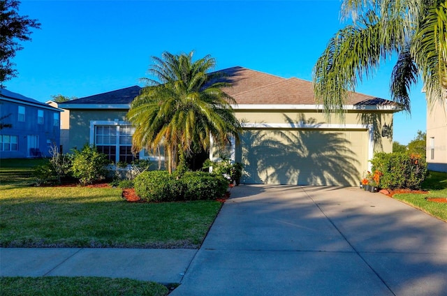 view of front facade featuring a front lawn and a garage