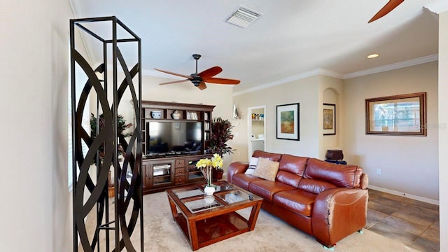 tiled living room with washer / dryer, ceiling fan, and ornamental molding