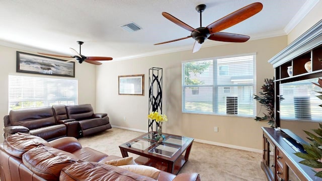 living room featuring light colored carpet, ceiling fan, and plenty of natural light