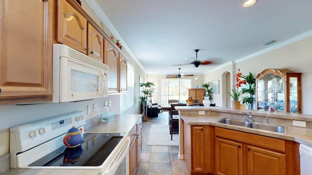 kitchen featuring light tile floors, ceiling fan, white appliances, crown molding, and sink