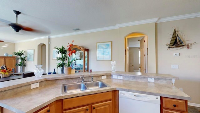 kitchen featuring ceiling fan, a textured ceiling, crown molding, dishwasher, and sink