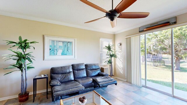 living room featuring ornamental molding and ceiling fan