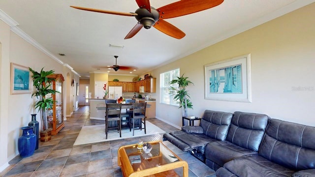 tiled living room with ornamental molding and ceiling fan