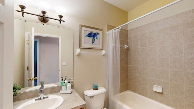 full bathroom featuring shower / bath combination with curtain, toilet, and vanity