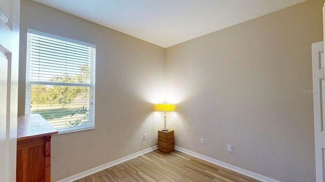 spare room with light hardwood / wood-style floors