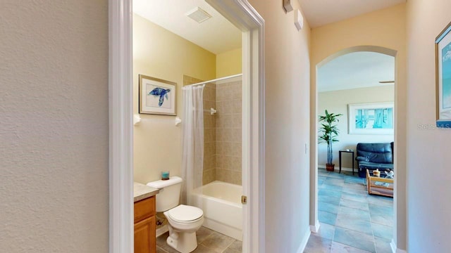 full bathroom featuring vanity, tile flooring, shower / bath combo, and toilet