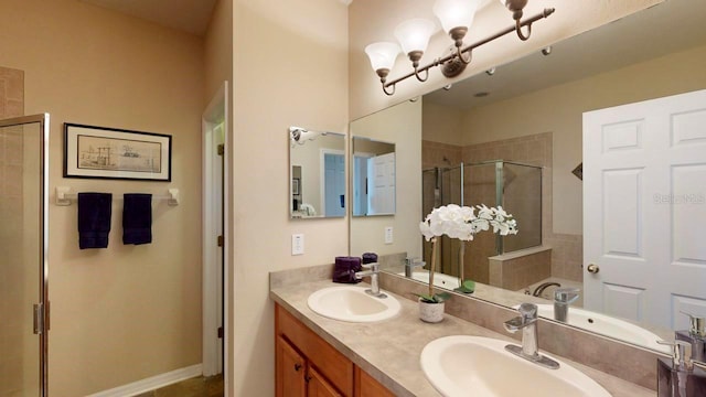 bathroom with double sink vanity and walk in shower