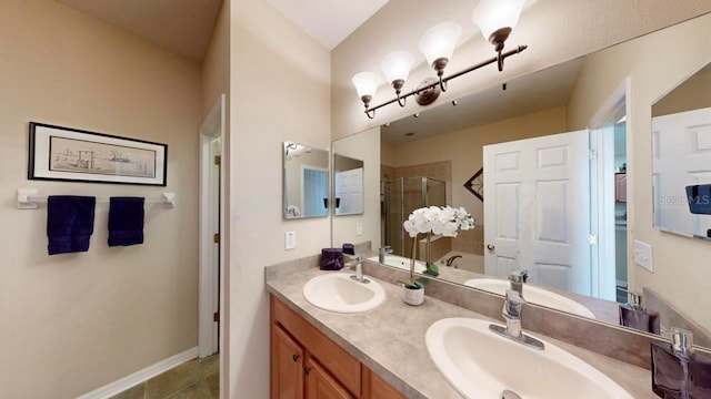 bathroom with oversized vanity, tile floors, and dual sinks