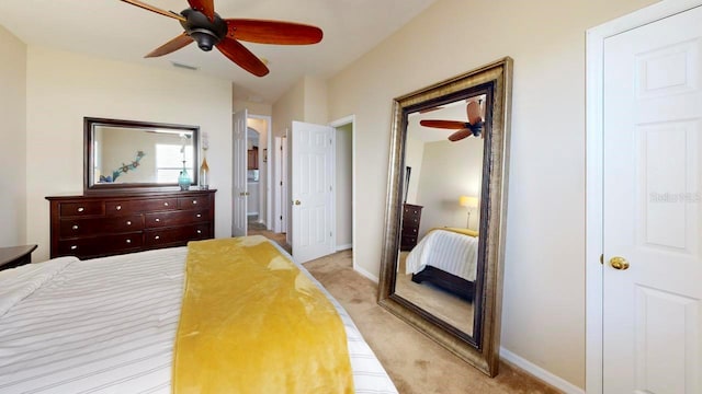 carpeted bedroom with ceiling fan