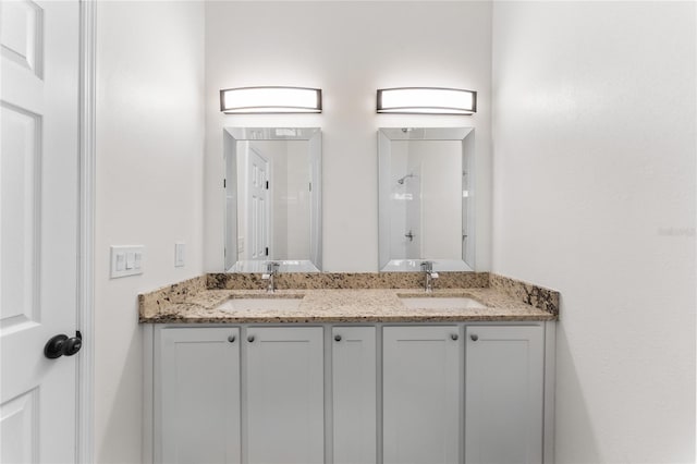 bathroom with dual bowl vanity