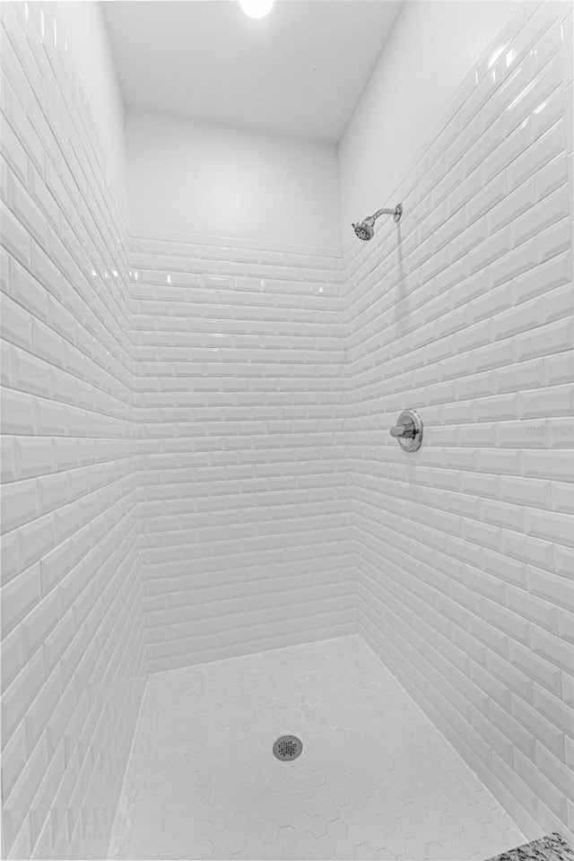 bathroom with a tile shower