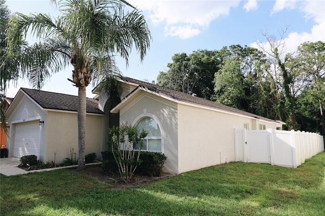 view of front of home with a garage and a front yard