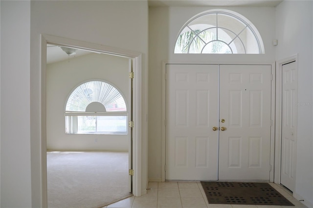 foyer with light carpet