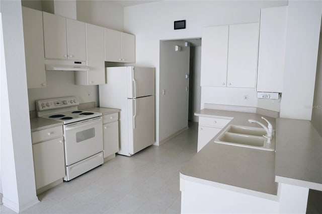 kitchen with white cabinets, sink, white appliances, and light tile floors