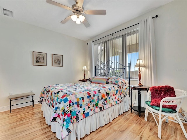 bedroom featuring ceiling fan and light hardwood / wood-style flooring